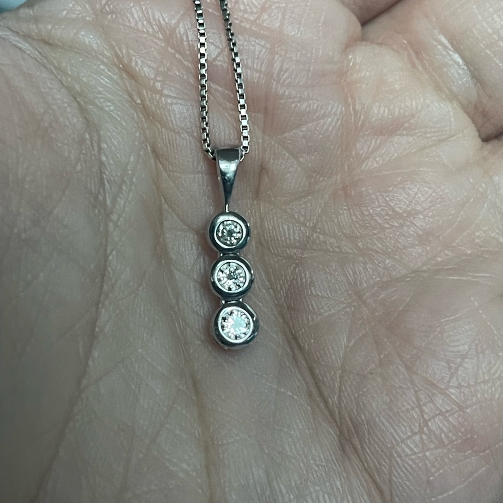 COPY - This necklace from Zales features a 3/4 carat 3 diamond pendant.